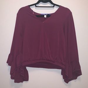 Maroon top with front button.